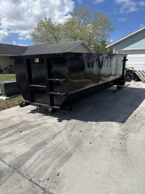 Clean 20-yard roll-off dumpster delivered to a driveway in the Fort Myers area