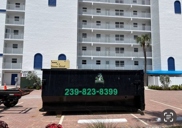 Branded Dependable Dumpster Services roll-off dumpster in Lee County, FL